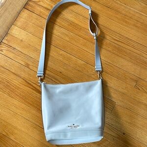 Kate Spade grey-silver colored crossbody or shoulder purse.